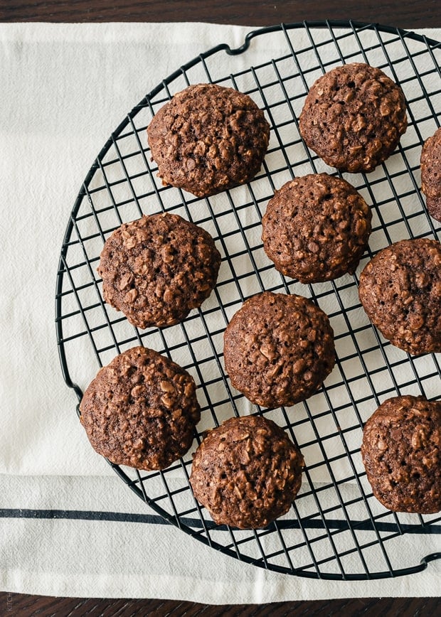 A cooking rack filled with homemade Chocolate Oatmeal Cookies.