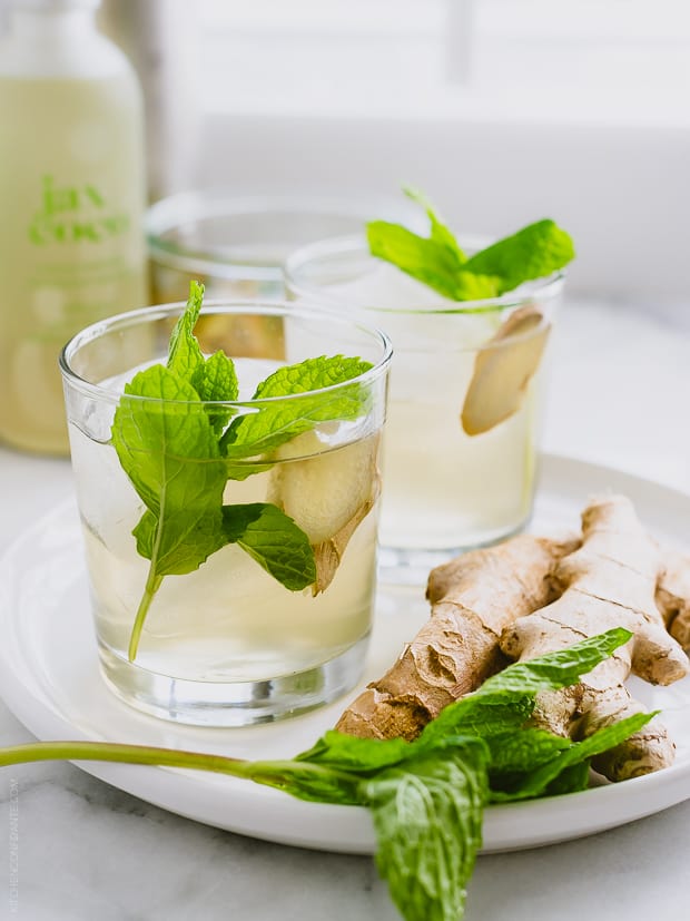 Ginger-Mint Coconut Water Coolers garnished with mint and ginger.