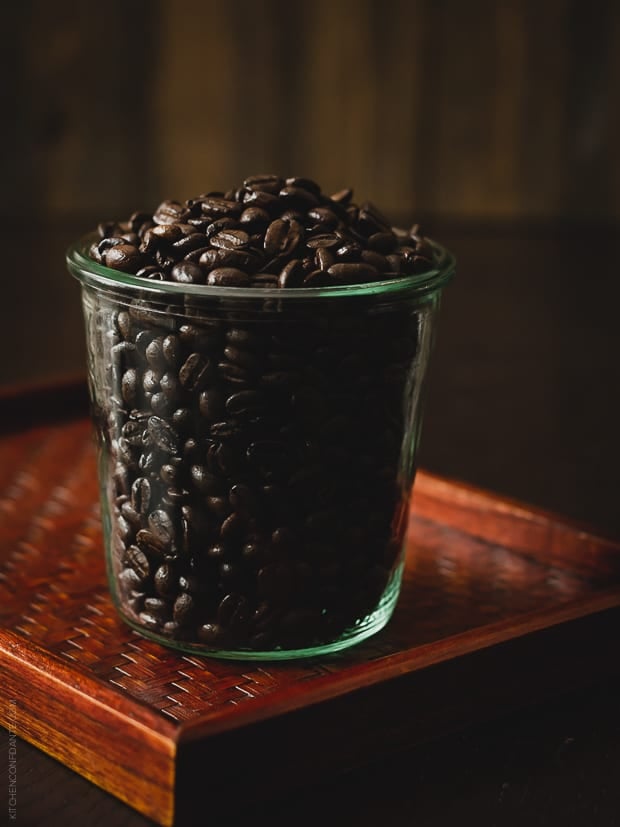 Coffee beans in a glass jar.