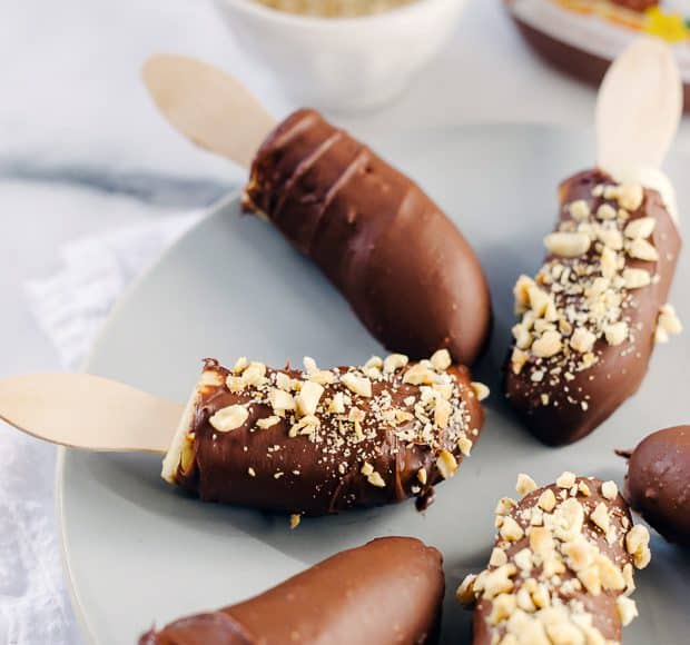 Nutella-Dipped Frozen Bananas arranged on a serving plate.