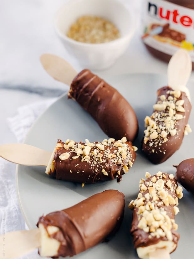 Nutella-Dipped Frozen Bananas arranged on a serving plate.