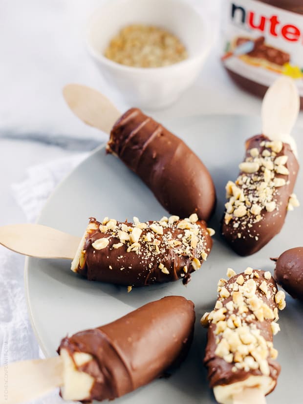 Nutella-Dipped Frozen Bananas arranged on a serving plate.