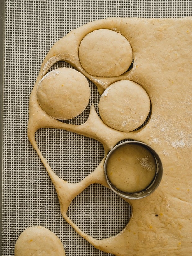 Cutting out dough circles to make Nutella Filled Mini Doughnuts
