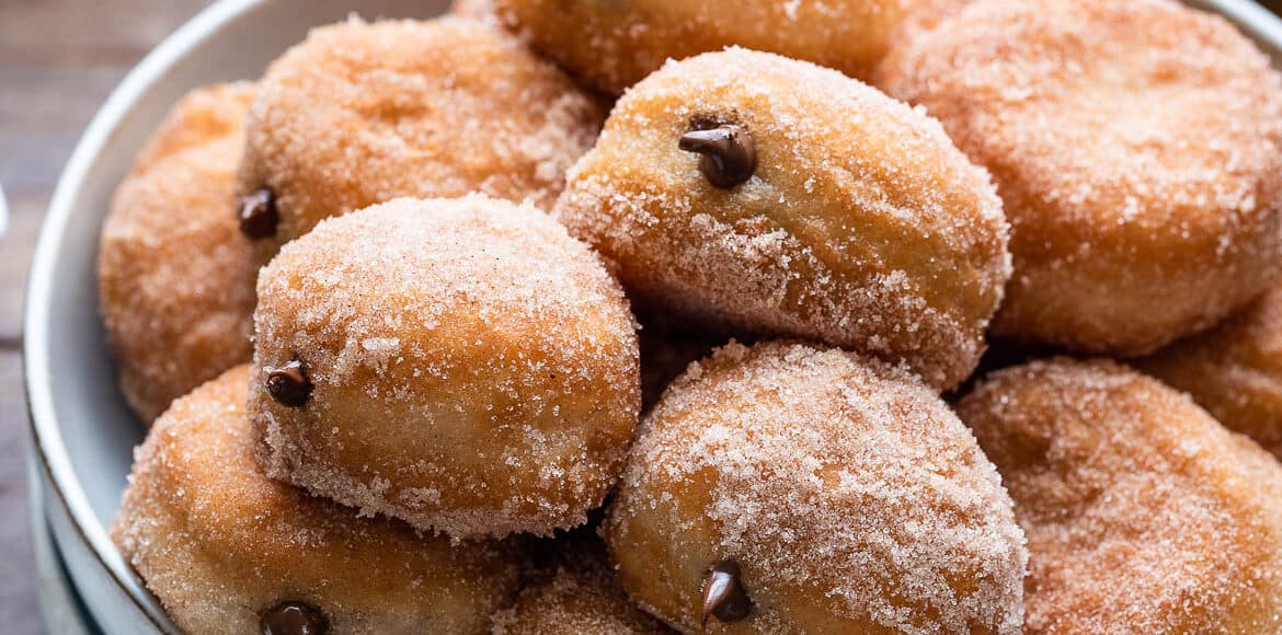 Nutella Filled Mini Doughnuts piled on a grey plate