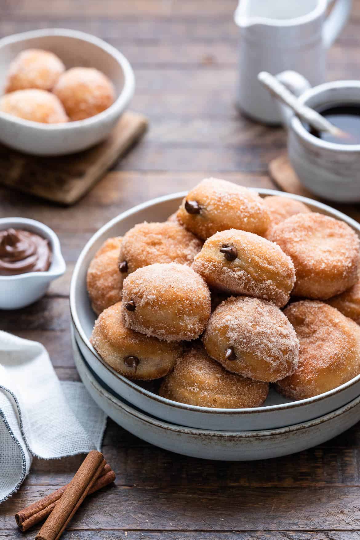 Nutella Filled Mini Doughnuts piled on a grey plate