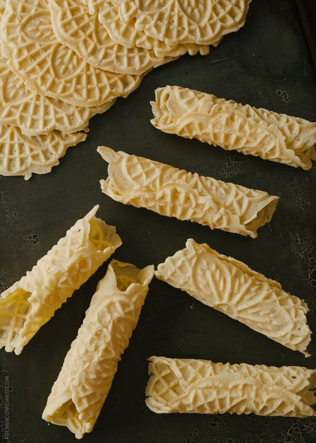 Rolled Pizzelle on a dark background.