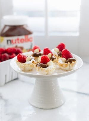 Nutella Greek Yogurt Phyllo Cups on a cake stand.