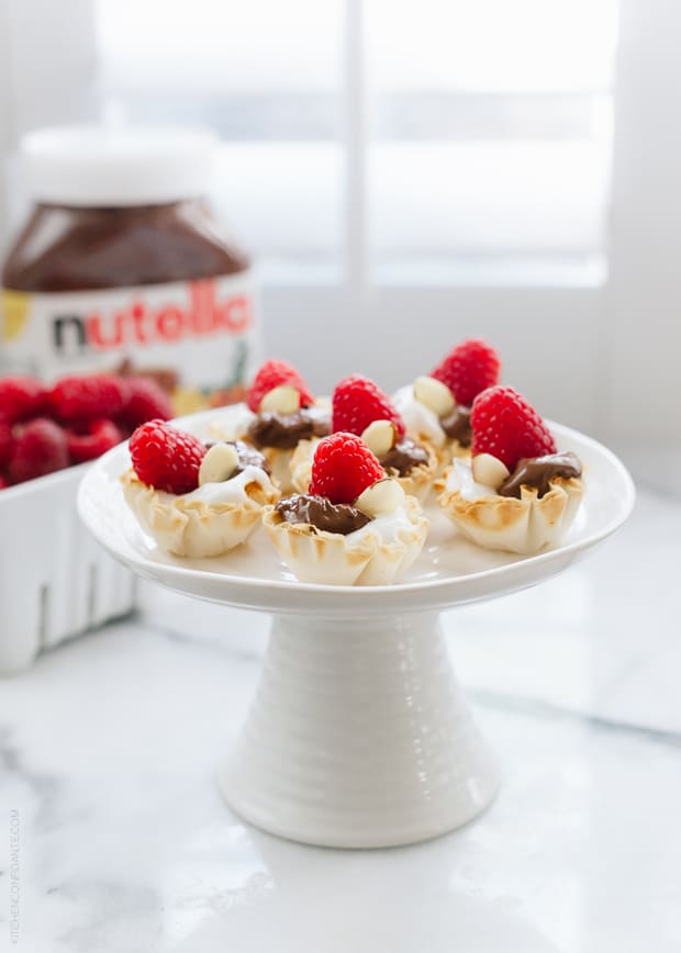 Nutella Greek Yogurt Phyllo Cups on a cake stand.