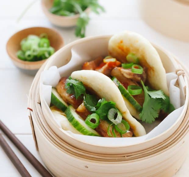 Pork Belly Buns garnished with cilantro and scallions.