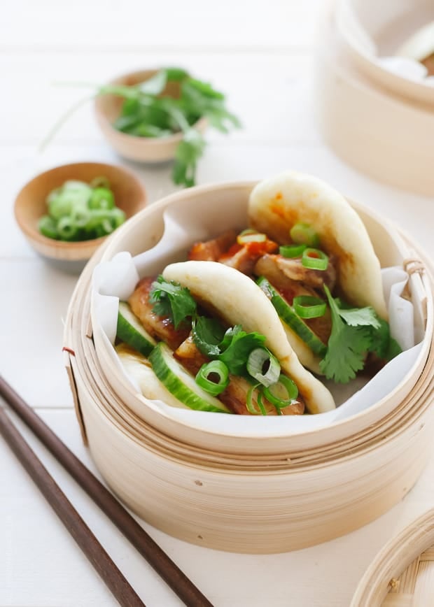 Pork Belly Buns garnished with cilantro and scallions.