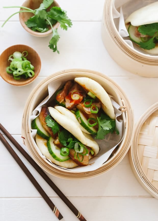 Pork Belly Buns garnished with cilantro and scallions.