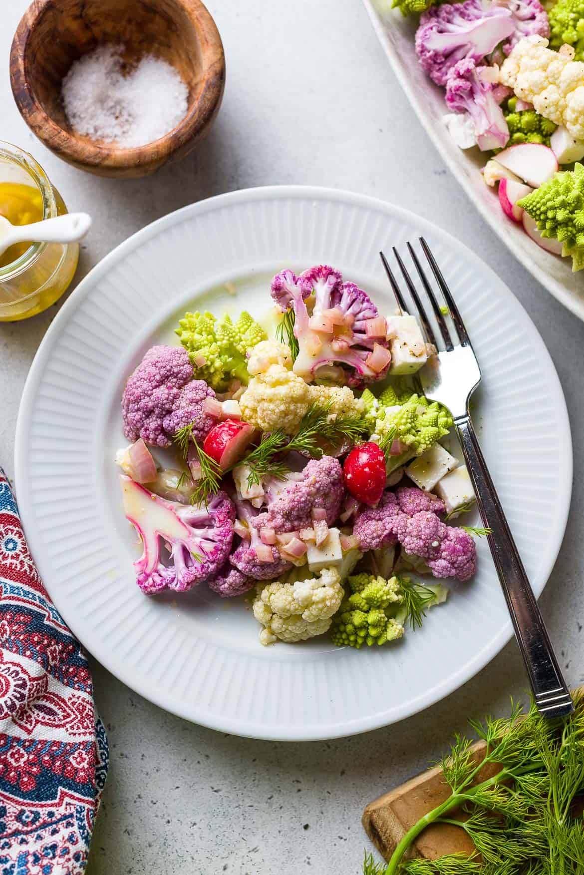 Tri-Color Cauliflower Salad in a white bowl.
