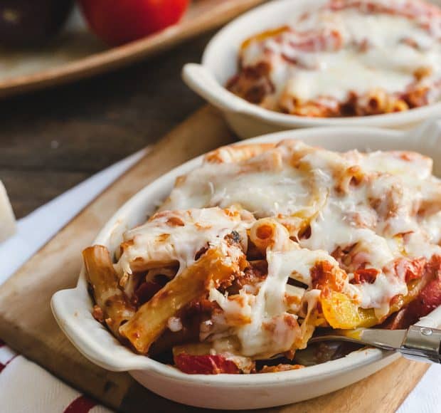 Baked Ziti with Roasted Eggplant and Peppers in a white baking dish.