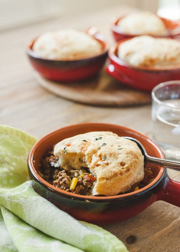 Buttermilk-Gruyere Biscuit Topped Shepherd's Pie in a small handled dish.