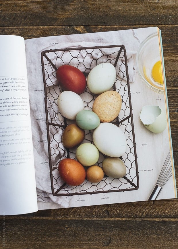 Open pages of The New Greenmarket Cookbook on a wooden surface.