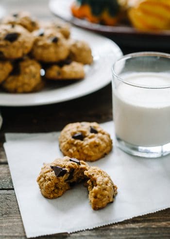 Pumpkin Chocolate Chip Oatmeal Cookies served with a glass of milk.