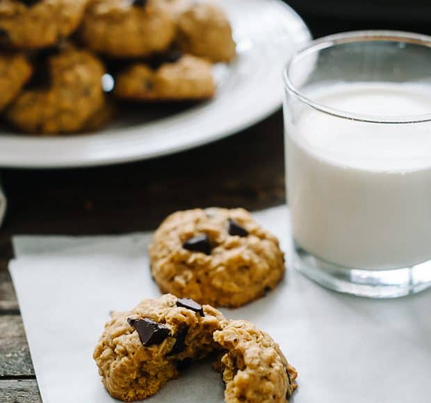 Pumpkin Chocolate Chip Oatmeal Cookies served with a glass of milk.