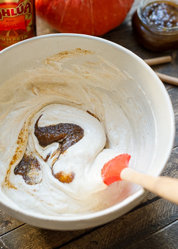 Mixing pumpkin butter into a creamy mascarpone filling.