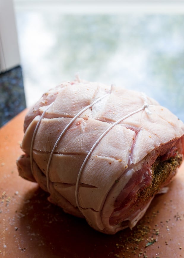 Rolled pork middle tied with twine to make Porchetta.