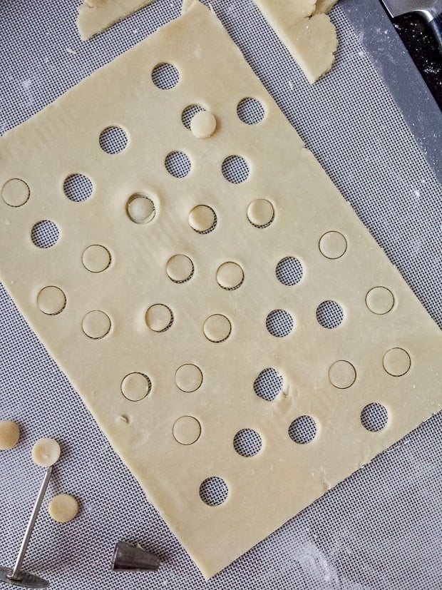 Preparing a large rectangle of pie dough for a slab pie.