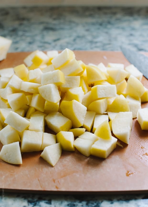 Chopped apples on a cutting board.