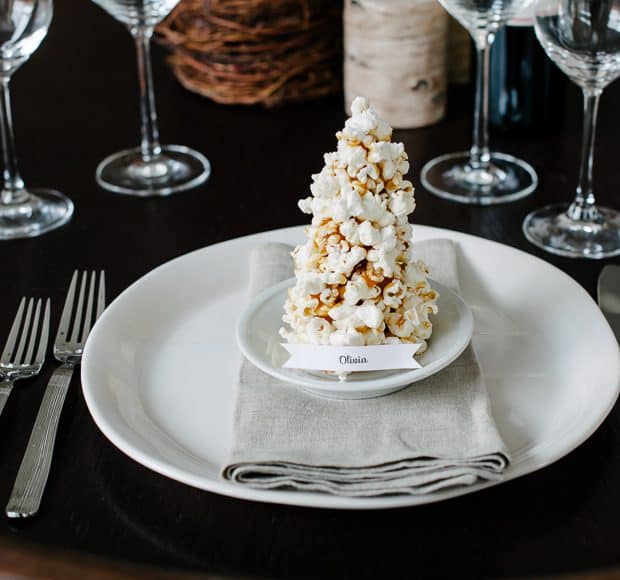 A place card made from popcorn and caramel shaped into a Christmas tree.