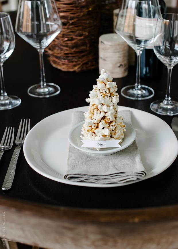 A place card made from popcorn and caramel shaped into a Christmas tree.