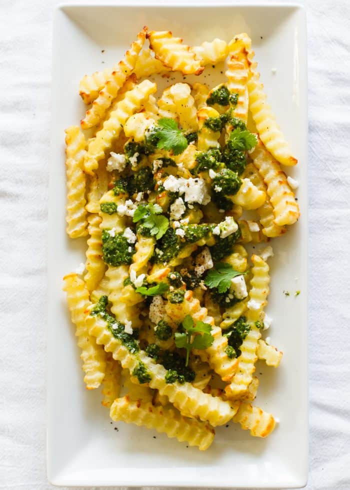 Chimichurri Fries with Queso Fresco | www.kitchenconfidante.com | Dress your fries in a bold chimichurri for the perfect savory snack