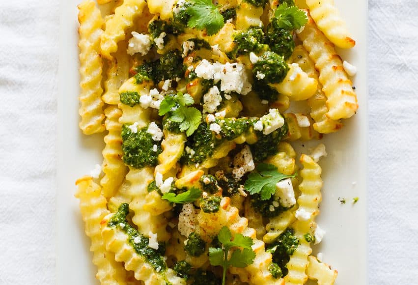Chimichurri Fries with Queso Fresco | www.kitchenconfidante.com | Dress your fries in a bold chimichurri for the perfect savory snack
