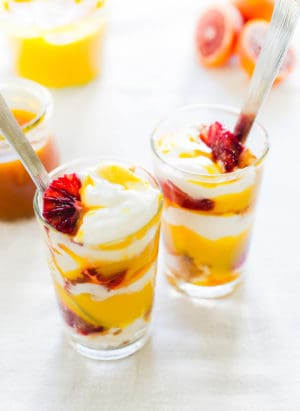 Passion Fruit Blood Orange Trifle in glasses with slices of blood orange.