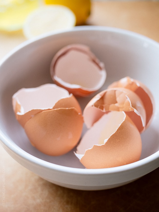 Empty eggshells in a white bowl.