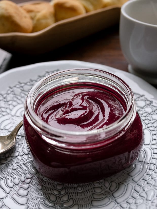 A glass jar of homemade Blueberry Lemon Curd.