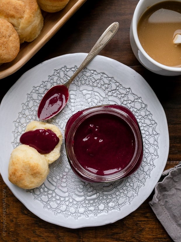 Homemade Blueberry Lemon Curd spread on a biscuit.