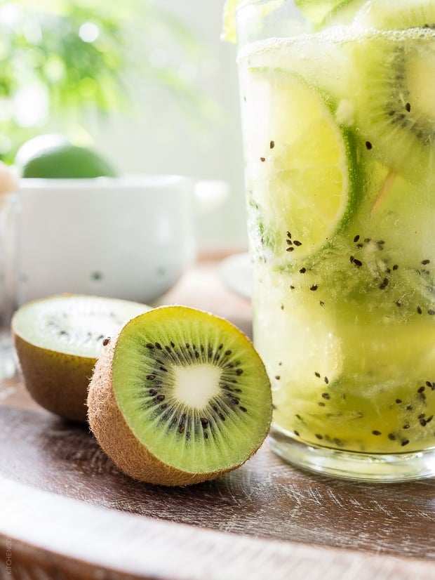 Fresh kiwi alongside a Kiwi Mint Mojito. 