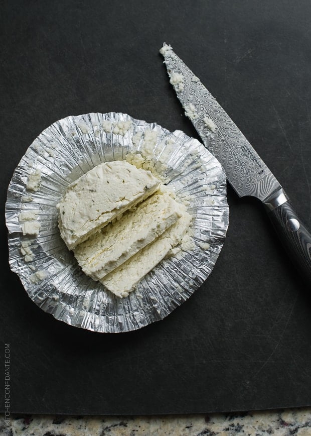Boursin cheese sliced, in a foil wrapper.