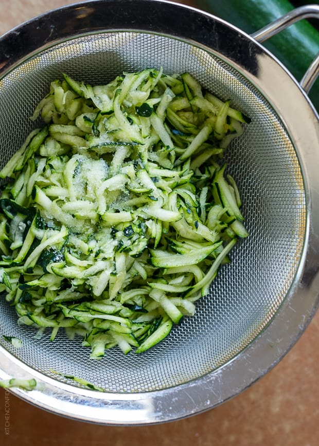 Grated zucchini ready to bake into snack-friendly fritters.