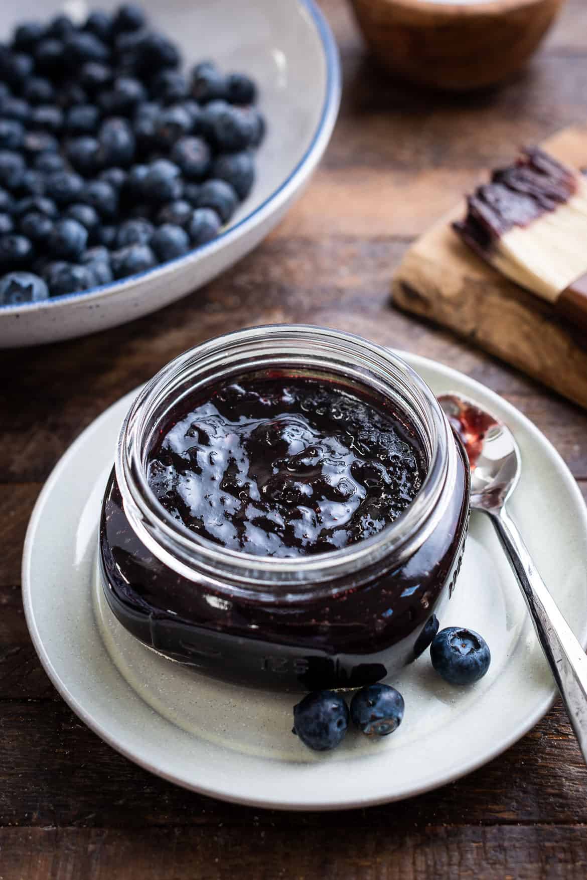 A glass bowl filled with Blueberry Balsamic Barbecue Sauce.