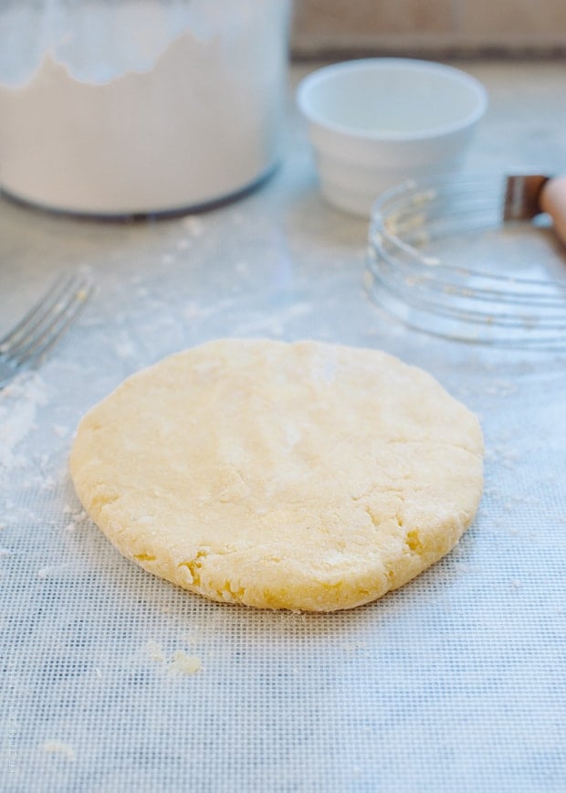 Cornmeal crust on a work surface.