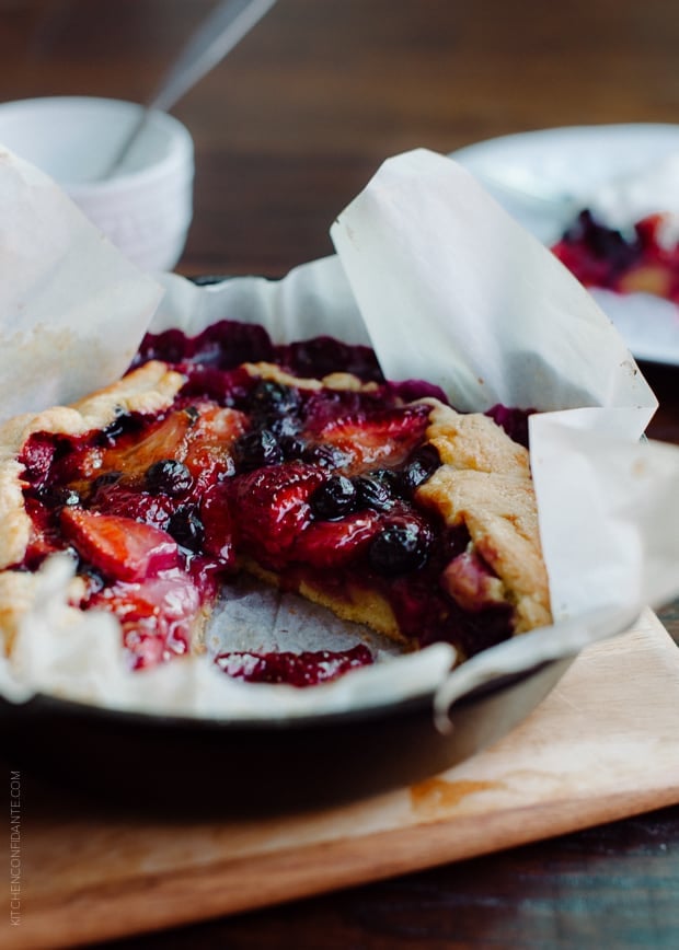 Mixed Berry Cornmeal Galette in a cast iron skillet.