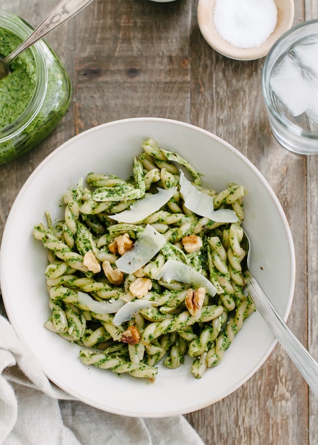 A bowl filled with a portion of Swiss Chard Walnut Pesto Pasta.