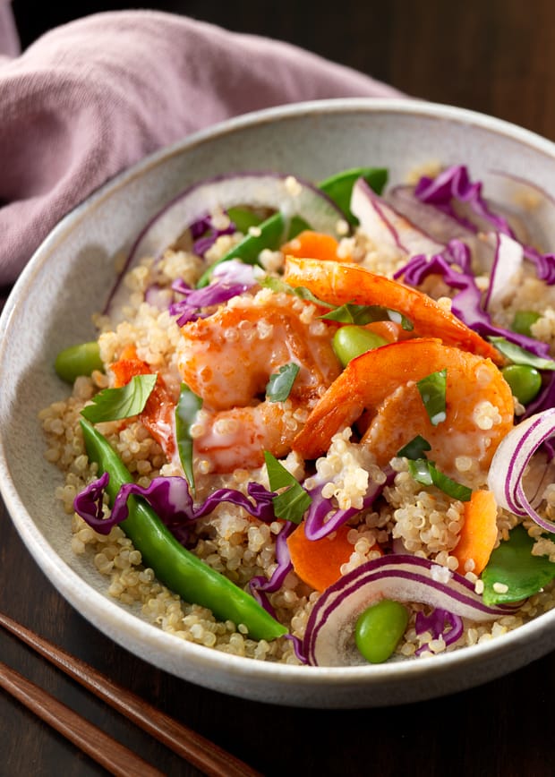 Thai Shrimp and Coconut Quinoa Bowl on a wooden surface.