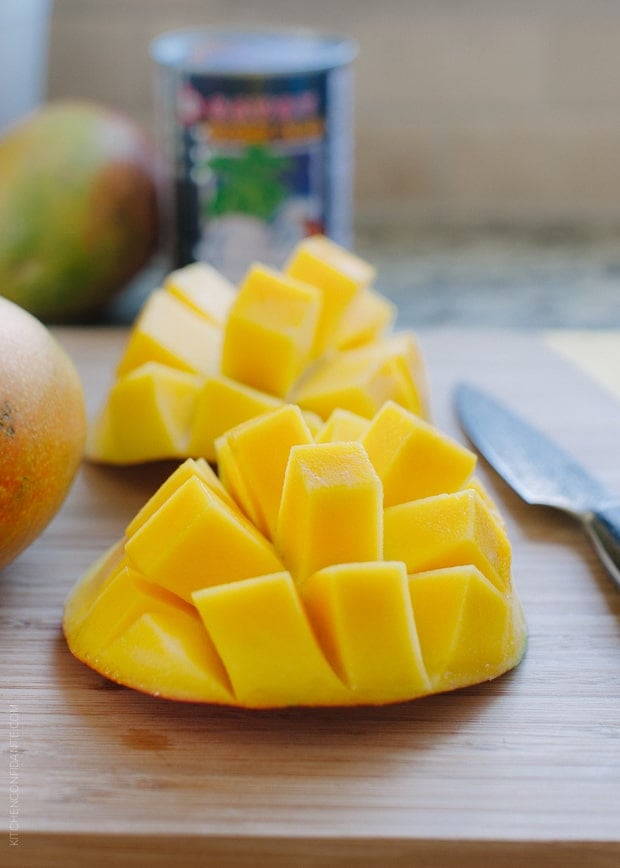 Fresh mangoes cut into sections.