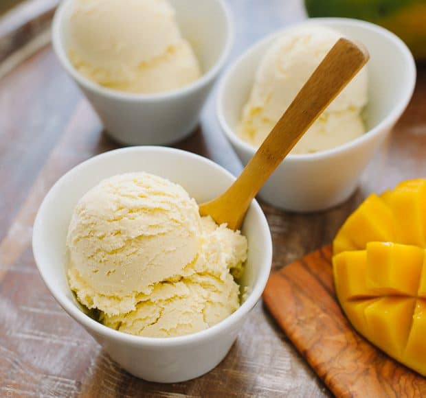 Scoops of healthier Dairy Free Mango Coconut Ice Cream in white bowls.