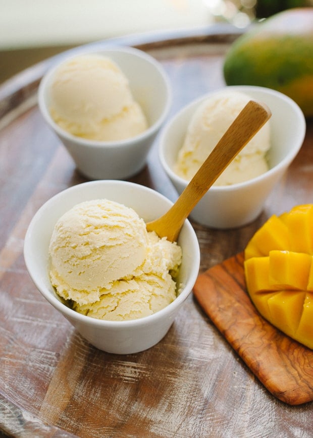 Scoops of healthier Dairy Free Mango Coconut Ice Cream in white bowls.