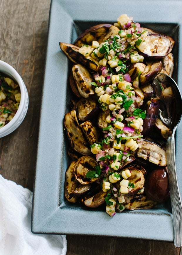 Grilled Eggplant with Corn Chimichurri in a serving dish.