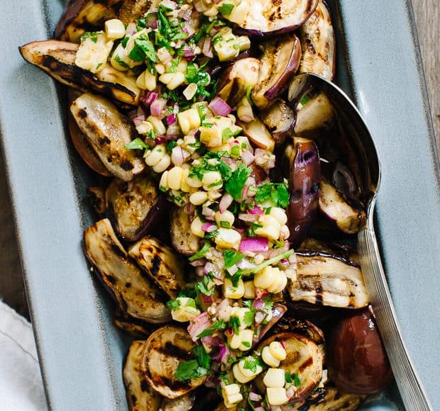 Grilled Eggplant with Corn Chimichurri in a serving dish.