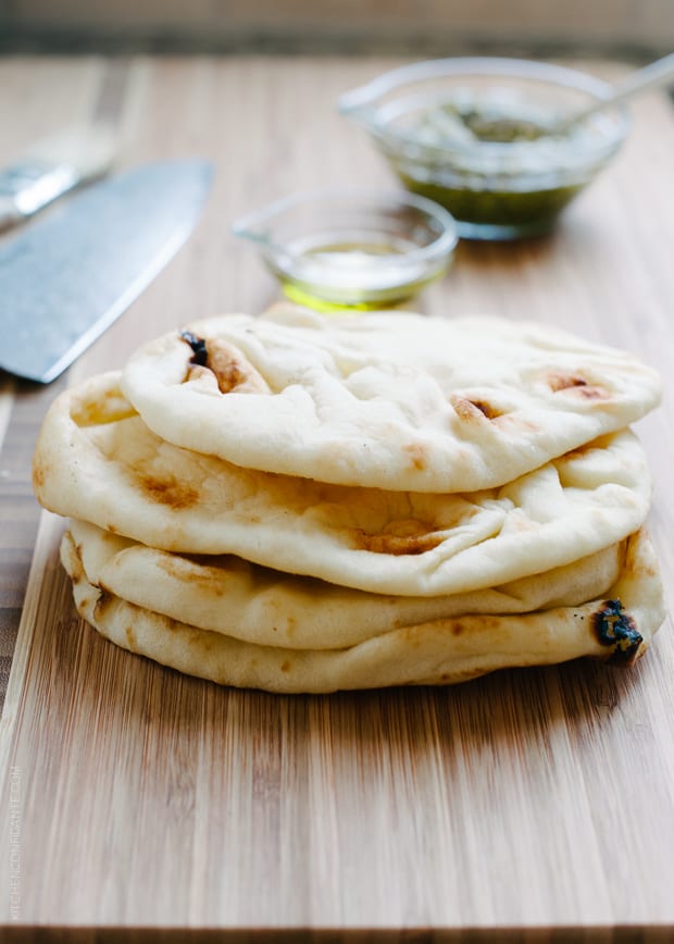 A stack of fluffy naan breads. 