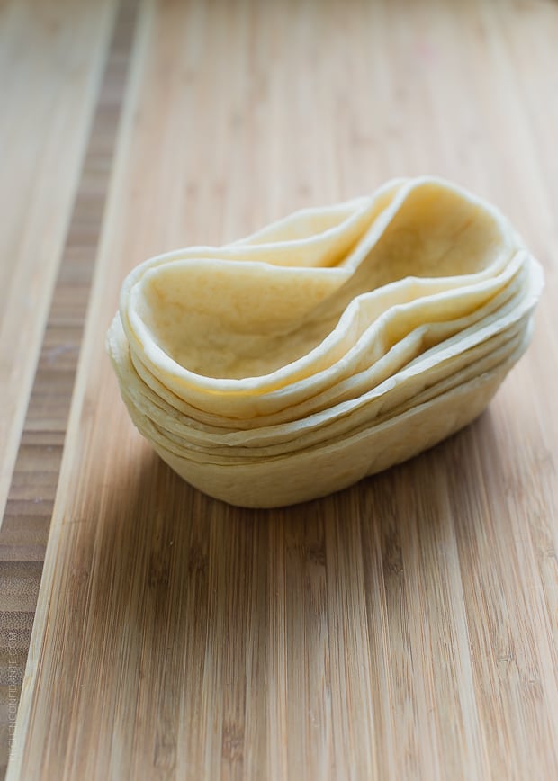 Taco Boat shells on a wooden surface.