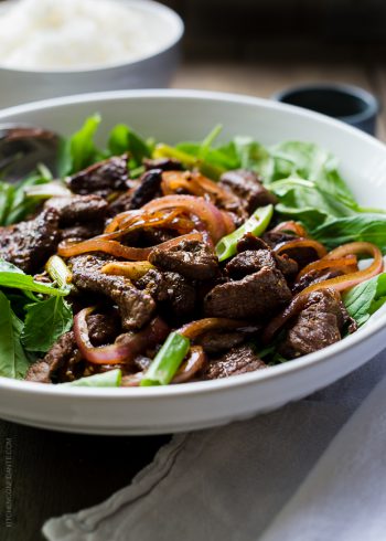 Shaking Beef stir fry served in a large white dish.