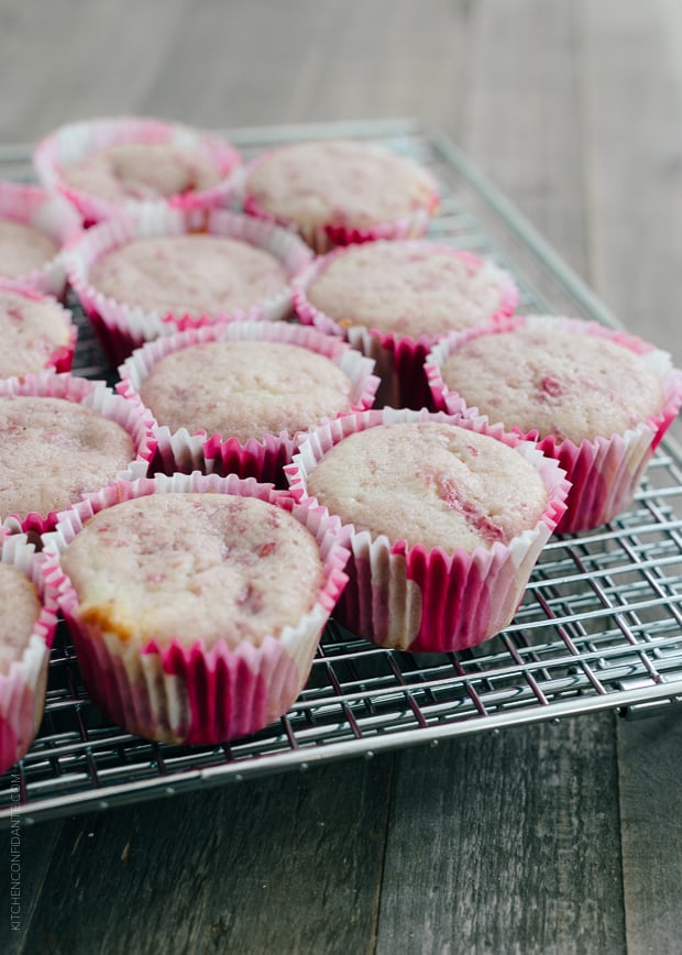 Roasted Berry Cupcakes on a cooling rack.